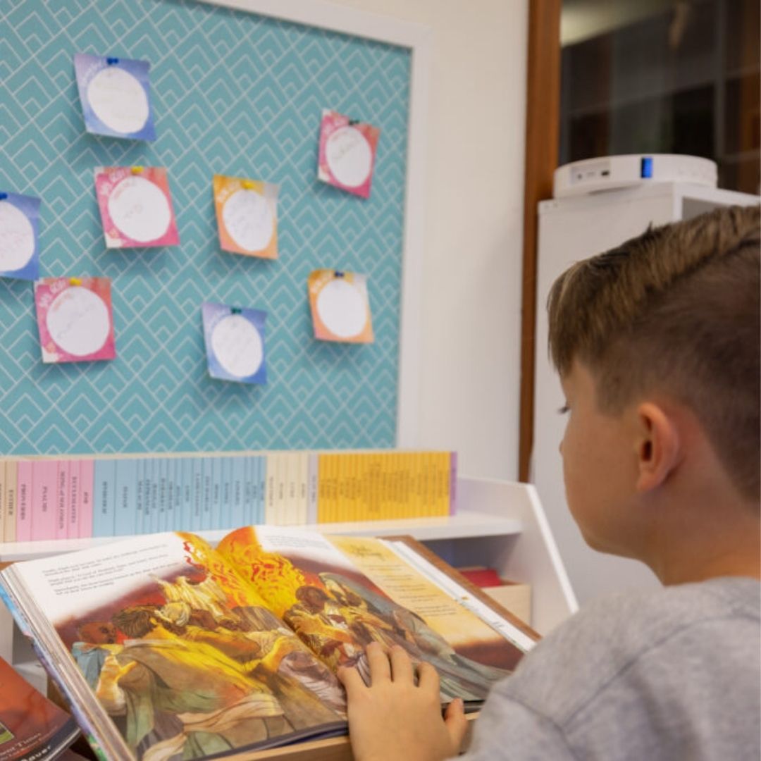 young boy reading