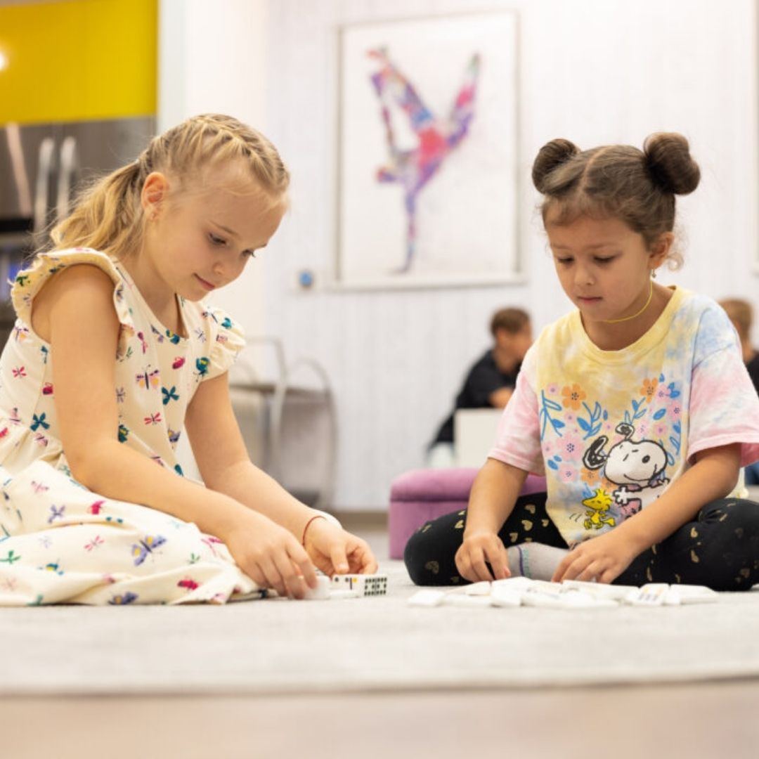 An image of two girls playing together.